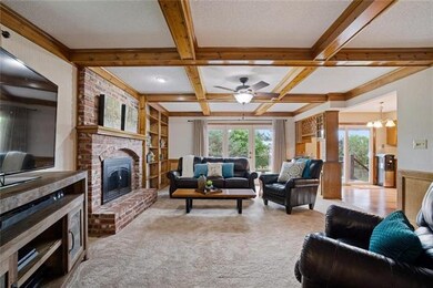 The spacious great room features a brick fireplace
