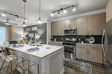 Kitchen featuring light stone countertops, ceiling