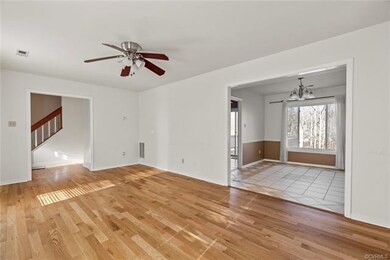 Living Room with view of foyer and Dining Room.