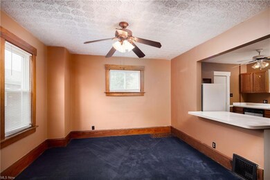 Dining area includes a breakfast bar and is open t