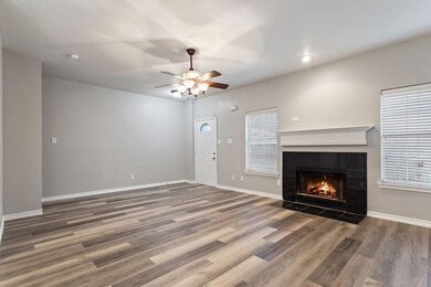 Unfurnished living room with hardwood / wood-style