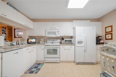 Kitchen featuring light tile patterned flooring, s