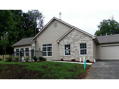 Exterior Front. Side view with two car garage