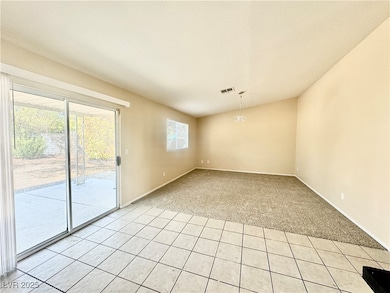 Living room & back patio slider leading to back pa