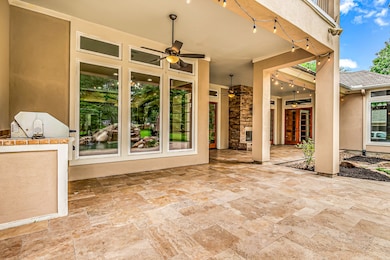 Spacious covered patio and outdoor kitchen create a peaceful retreat where you can escape the hustle and bustle of everyday life and reconnect with nature.