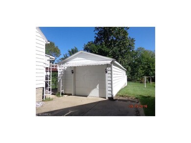 detached garage and entry to the covered patio pat