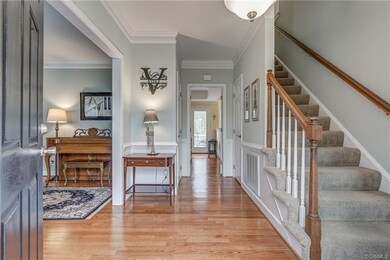 Foyer with Hardwood Floors, Crown Molding, Chair R