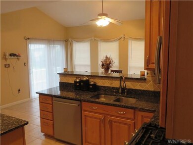 Kitchen. Upgraded kitchen features Maple cabinets,