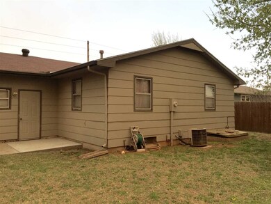 Back of the house and the new concrete pad just po