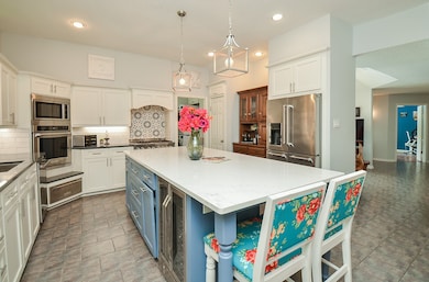 Eat-in kitchen accommodates two bar stools.