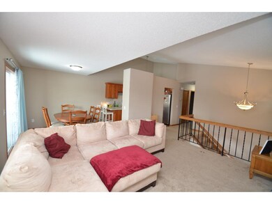 The living room is open to the dinette and kitchen