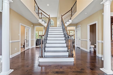 Fabulous, grand double-staircase upon entry...