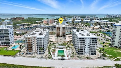 View of urban area featuring a pool area and Gulf of America - Virtually Edited Image
