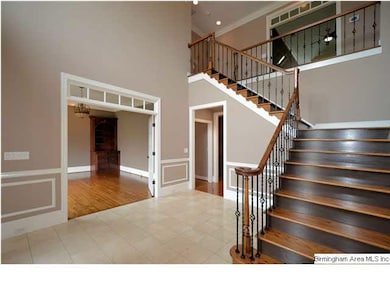 Stairs (from foyer and kitchen) lead to bedrooms,b