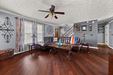 Living room with ceiling fan, hardwood / wood-styl