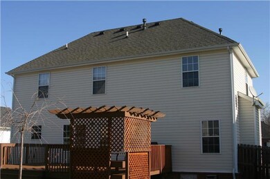 Back of house, private fenced in yard, large deck and arbor for entertaining.
