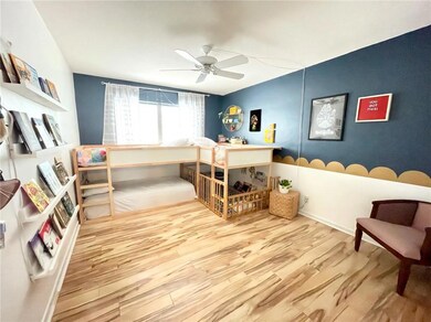 Large bedroom with laminate wood flooring