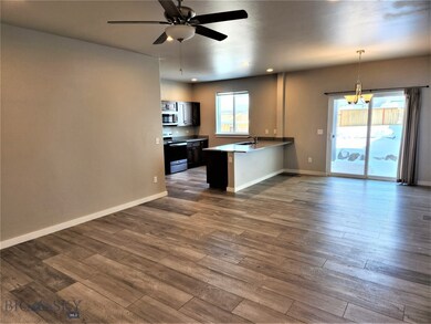 Living area, looking into dining area and kitchen