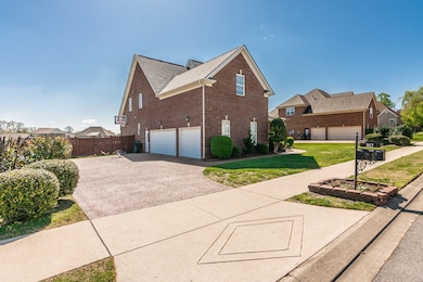 Plenty of parking on this wide aggregate driveway that has been freshly sealed!