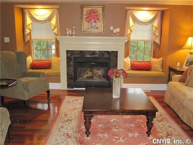 Living Room Windows grace either side of gas firep
