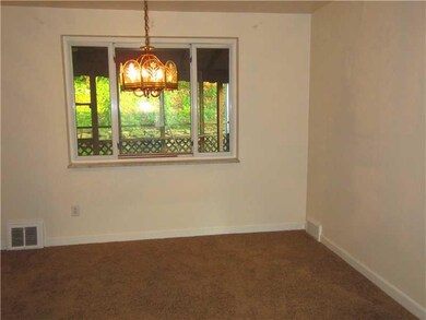 Dining Room. The Dining Room is open to the Kitchen, Living Room, and First Floor Family Room.