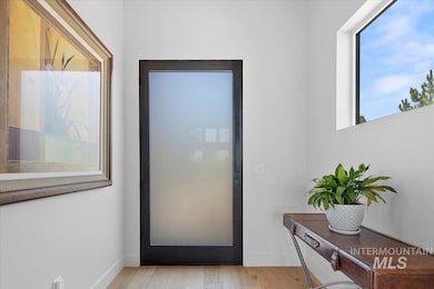 Entryway with light wood finished floors