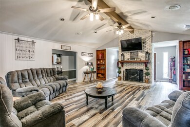 Large open living area with new bead board walls and new flooring