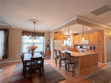 ELEGANT DINING ROOM, WITH NEW PERGO FLOORS.