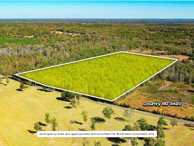 Aerial view of property's location with a heavily wooded area and property boundaries highlighted