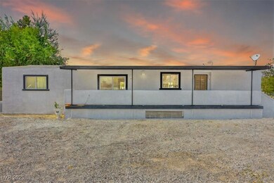 View of back of house at dusk