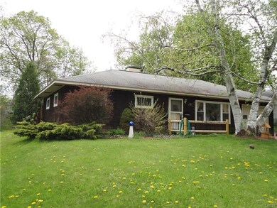 Newer windows, nicely landscaped with mature trees