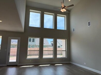 Empty room with a towering ceiling, dark wood-sty