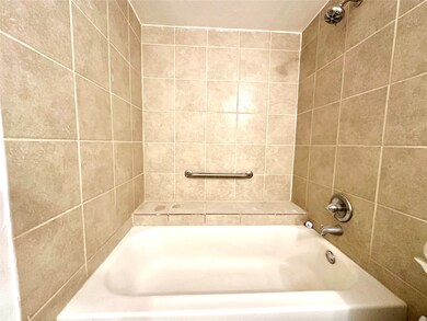 Large tub shower combo with sitting area