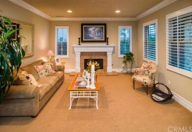 Formal Living Room features a fireplace, plantatio