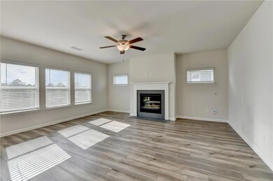Unfurnished living room with a fireplace with flus