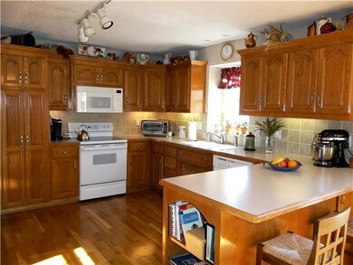 Pantry, plentiful cabinets, and breakfast bar.