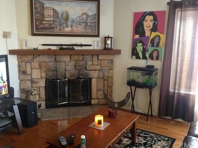 View of Fireplace and mantel, Hardwood floors.