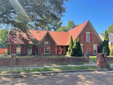View of front of home featuring brick siding and a shingled roof