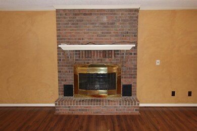 The beautiful floor-to-ceiling brick fireplace.