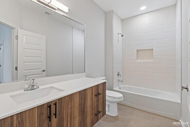 Full bath with vanity, bathtub / shower combination, and toilet