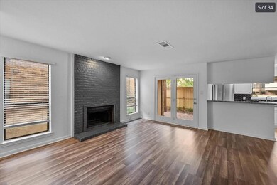 Unfurnished living room featuring visible vents, a