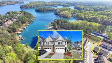 Aerial view with a water view and a wooded view