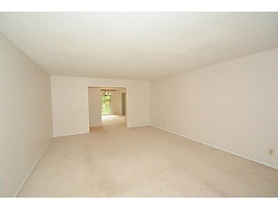 Living Room. Freshly painted with newer carpet.