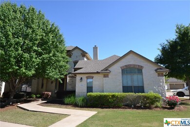 Immaculate landscaping around unit, sidewalk, tree