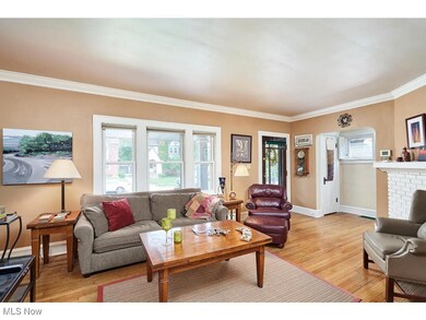 Living room with plenty of natural light and hard wood floors