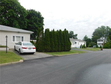 Mature landscaping provides privacy in side yard a
