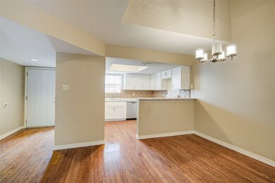 The dining area seamlessly flows into the kitchen,