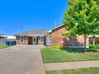 Ranch-style house with brick siding, concrete driveway, roof with shingles, and an attached garage