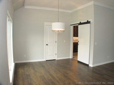 The barn door allows easy access between the kitch