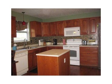 Kitchen. Cherry kitchen cabinets, custom back spla
